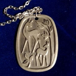 Vintage deer pendant marked Pewter H.S. Made in Norway. Pendant is approx. 2 in.